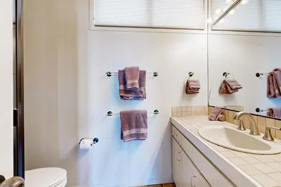 a bathroom with a sink and a mirror at Forever Views in San Diego