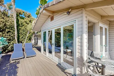 a porch of a house with chairs and a table at Forever Views in San Diego
