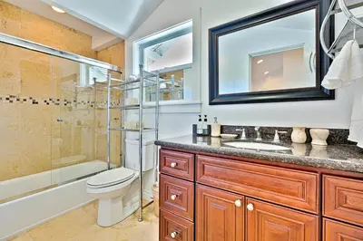a bathroom with a toilet sink and a shower at Casa Dolce in San Diego