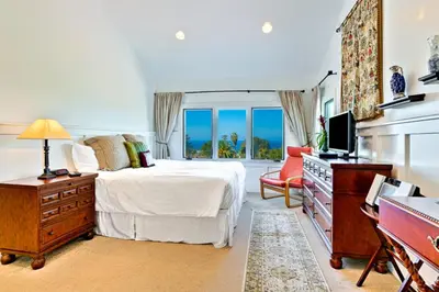 a bedroom with a bed and a television in it at Casa Dolce in San Diego