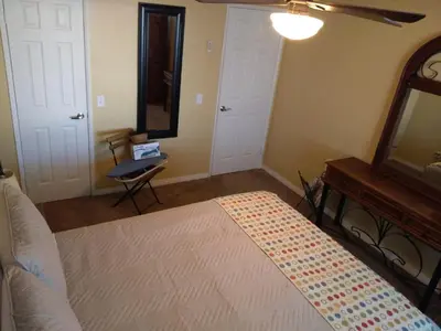 a bedroom with a bed and a mirror and a table at Departamento completo en San Diego & Bonita You can ask for 30 or more days book and save aditional 15 percent in San Diego