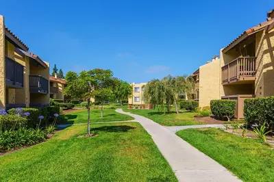 a walkway between two apartment buildings in a park at Departamento completo en San Diego & Bonita You can ask for 30 or more days book and save aditional 15 percent in San Diego