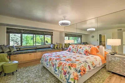 a bedroom with a bed and a large mirror at Luxe El Cajon Oasis with Pool, Fire Pit and Pavilion in El Cajon