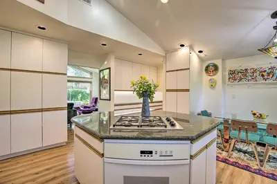 a kitchen with a stove and a counter top at Luxe El Cajon Oasis with Pool, Fire Pit and Pavilion in El Cajon