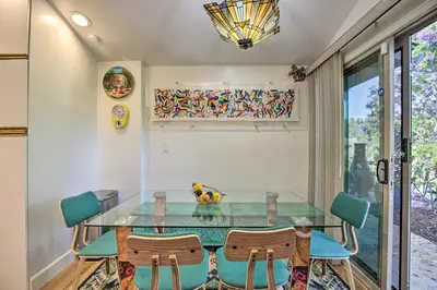 a dining room with a glass table and chairs at Luxe El Cajon Oasis with Pool, Fire Pit and Pavilion in El Cajon
