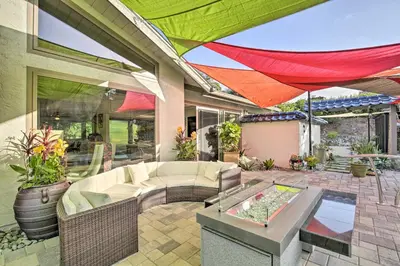 an outdoor patio with a couch and a table at Luxe El Cajon Oasis with Pool, Fire Pit and Pavilion in El Cajon