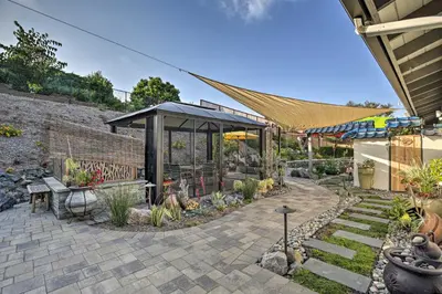 a garden with a gazebo and some plants at Luxe El Cajon Oasis with Pool, Fire Pit and Pavilion in El Cajon
