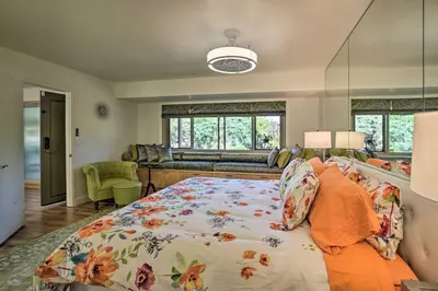 a bedroom with a bed and a living room at Luxe El Cajon Oasis with Pool, Fire Pit and Pavilion in El Cajon