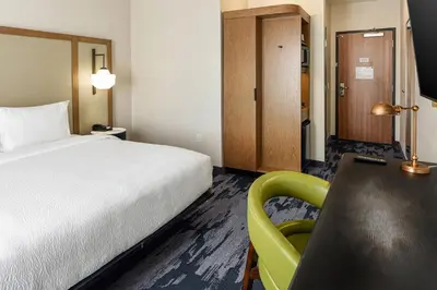 a bedroom with a bed and a desk and a chair at Fairfield Inn & Suites by Marriott Menifee in Menifee
