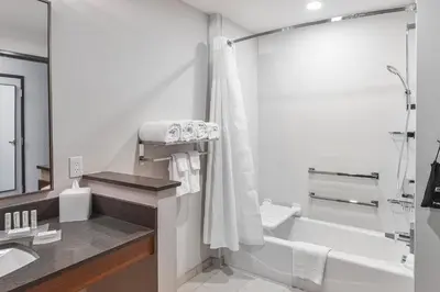 a bathroom with a tub and a sink and a shower at Fairfield Inn & Suites by Marriott Menifee in Menifee