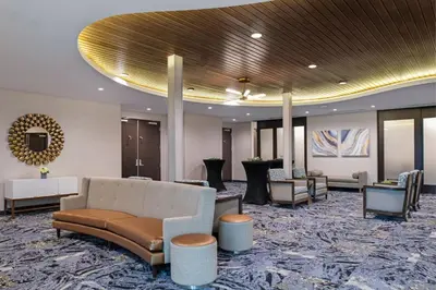 a lobby with a couch and chairs in a building at Fairfield Inn & Suites by Marriott Menifee in Menifee