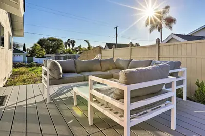 a couch sitting on a deck on a patio at Oceanside Home with Patio and Grill, Walk to Beach! in Oceanside