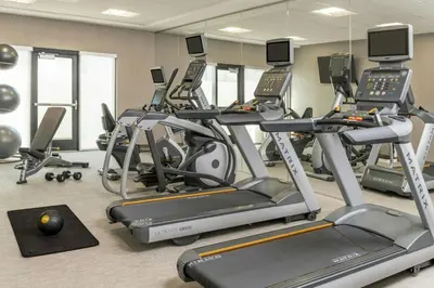 a gym with several exercise bikes and treadmills at SpringHill Suites by Marriott San Diego Carlsbad in Carlsbad