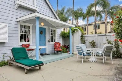 a house with a table and chairs on a patio at 1106 Park Avenue in Newport Beach