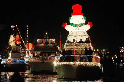 a group of boats with christmas lights on them at 1106 Park Avenue in Newport Beach
