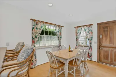 a dining room with a table and chairs at 1106 Park Avenue in Newport Beach