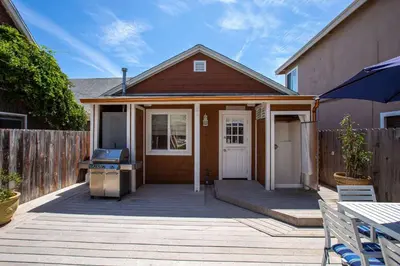 a house with a patio with a grill and a fence at 307 Thirty Fifth Street in Newport Beach