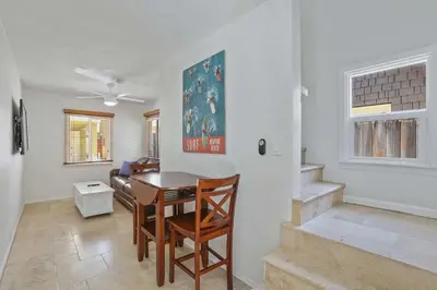 a dining room with a table and chairs in a room at 307 Thirty Fifth Street in Newport Beach