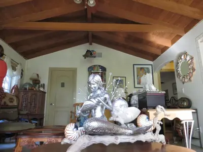 a statue on a table in a living room at Always Inn San Clemente Bed & Breakfast by Elevate Rooms in San Clemente