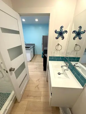 a bathroom with a sink and a mirror at Casita San Diego in San Diego