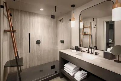a bathroom with a sink and a shower at Alila Marea Beach Resort Encinitas, a Hyatt Resort in Encinitas