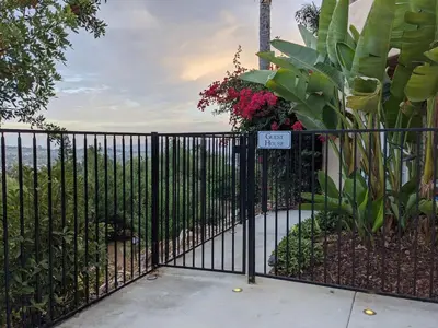 a black iron fence with a sign on it at Buena Creek Vista Primary Subdivided Home with Views and Pool in San Marcos
