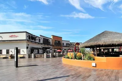 a courtyard of a resort with a thatch roof at 1000#3 Renovated Home by Beach & Sand - AC & More! in Newport Beach
