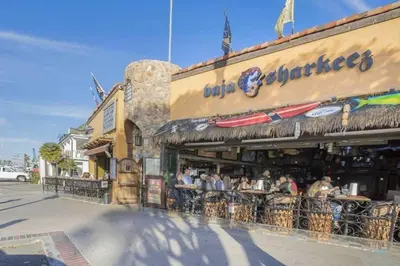 a group of people sitting outside of a restaurant at 1000#3 Renovated Home by Beach & Sand - AC & More! in Newport Beach