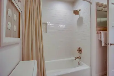 a bathroom with a tub and a toilet and a shower at Coastal Chic Style Condo SBTC 128 in Solana Beach