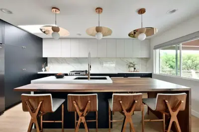 a kitchen with a large wooden table and chairs at Luxury Cardiff by-the-Sea Ocean View Penthouse in Encinitas