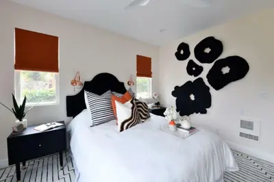 a bedroom with a bed with hearts on the wall at Luxury Cardiff by-the-Sea Ocean View Parkhouse in Cardiff-by-the-Sea