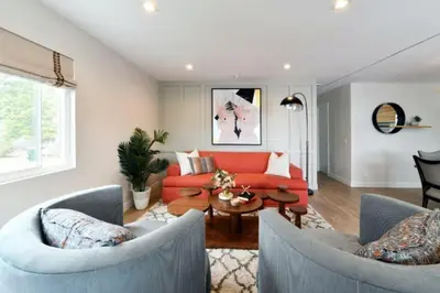 a living room with two chairs and a red couch at Luxury Cardiff by-the-Sea Ocean View Parkhouse in Cardiff-by-the-Sea
