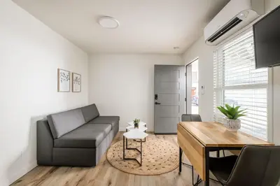 a living room with a couch and a table at The Marbella in Oceanside