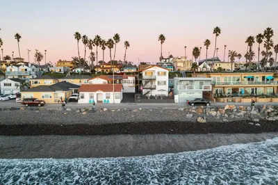 a view of a town with palm trees and the ocean at The Marbella in Oceanside