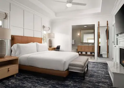 a bedroom with a large bed and a bathroom at Beach Village at The Del, LXR Hotels & Resorts in San Diego