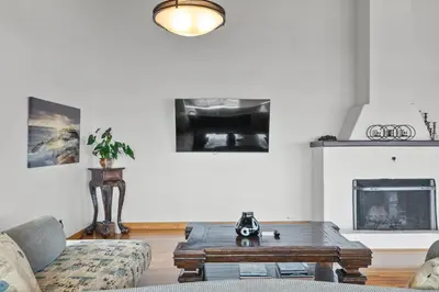 a living room with a couch and a coffee table at 26' SUNDECK OCEAN Panoramic VIEWS with AC Fast WiFi -902Mbps in San Diego