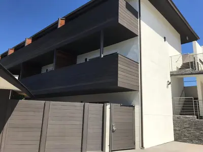 a house with a black and white facade at Sands Of La Jolla in San Diego