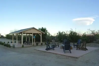 a gazebo with chairs and tables in the desert at Borrego Springs Motel in Borrego Springs
