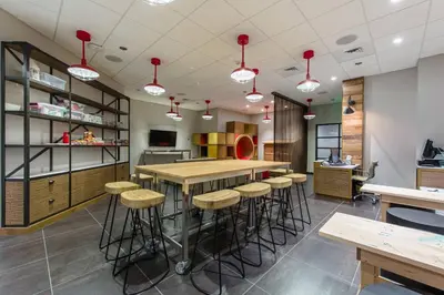 a kitchen with a bar and stools in a restaurant at Marriott Vacation Club®, San Diego    in San Diego
