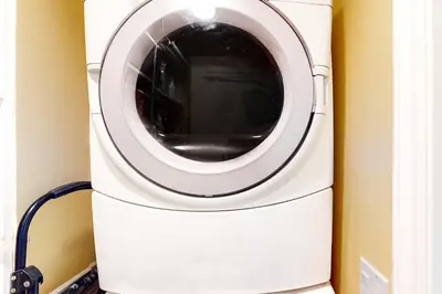 a washer and dryer in a room at Sycamore Beach Retreat in Carlsbad