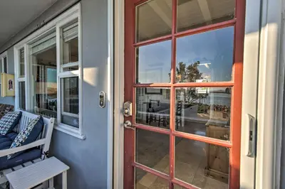 a red door on a porch with a window at San Diego Hub with Bay Views - 1 Block to Beach! in San Diego