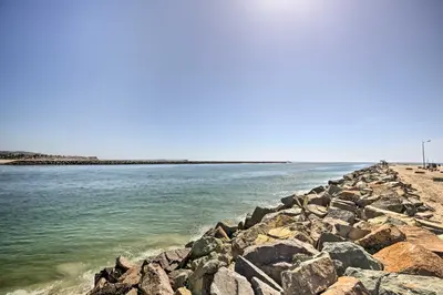 a group of rocks on a beach near the water at San Diego Hub with Bay Views - 1 Block to Beach! in San Diego