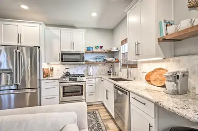 a kitchen with white cabinets and stainless steel appliances at Dog-Friendly San Diego Home - 1 Mi to Ocean Beach in San Diego