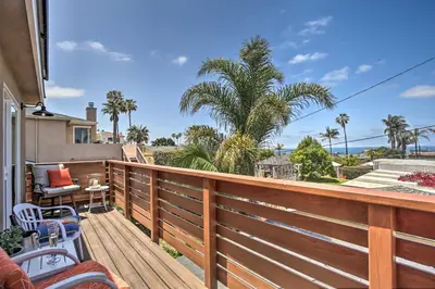 a deck with a view of the ocean and palm trees at Dog-Friendly San Diego Home - 1 Mi to Ocean Beach in San Diego