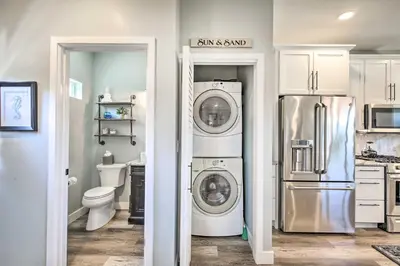 a kitchen with a refrigerator and a washer and dryer at Dog-Friendly San Diego Home - 1 Mi to Ocean Beach in San Diego