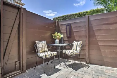 a patio with two chairs and a table in front of a fence at Dog-Friendly San Diego Home - 1 Mi to Ocean Beach in San Diego