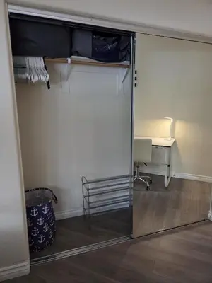 a sliding glass door in a room with a desk at Resort Like Stay at a Cozy Relaxing Private Room Near UCI in Irvine