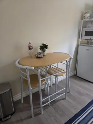 a table with a bottle of soda and a plant on it at Resort Like Stay at a Cozy Relaxing Private Room Near UCI in Irvine