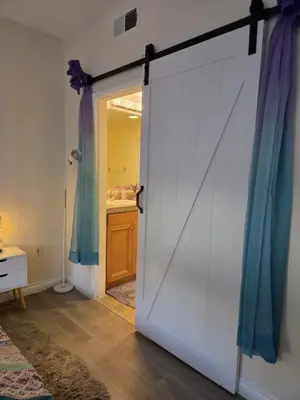 a sliding door in a room with a bathroom at Resort Like Stay at a Cozy Relaxing Private Room Near UCI in Irvine