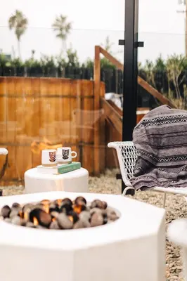 a white table with a tray of donuts on it at The Green Room Hotel in Oceanside
